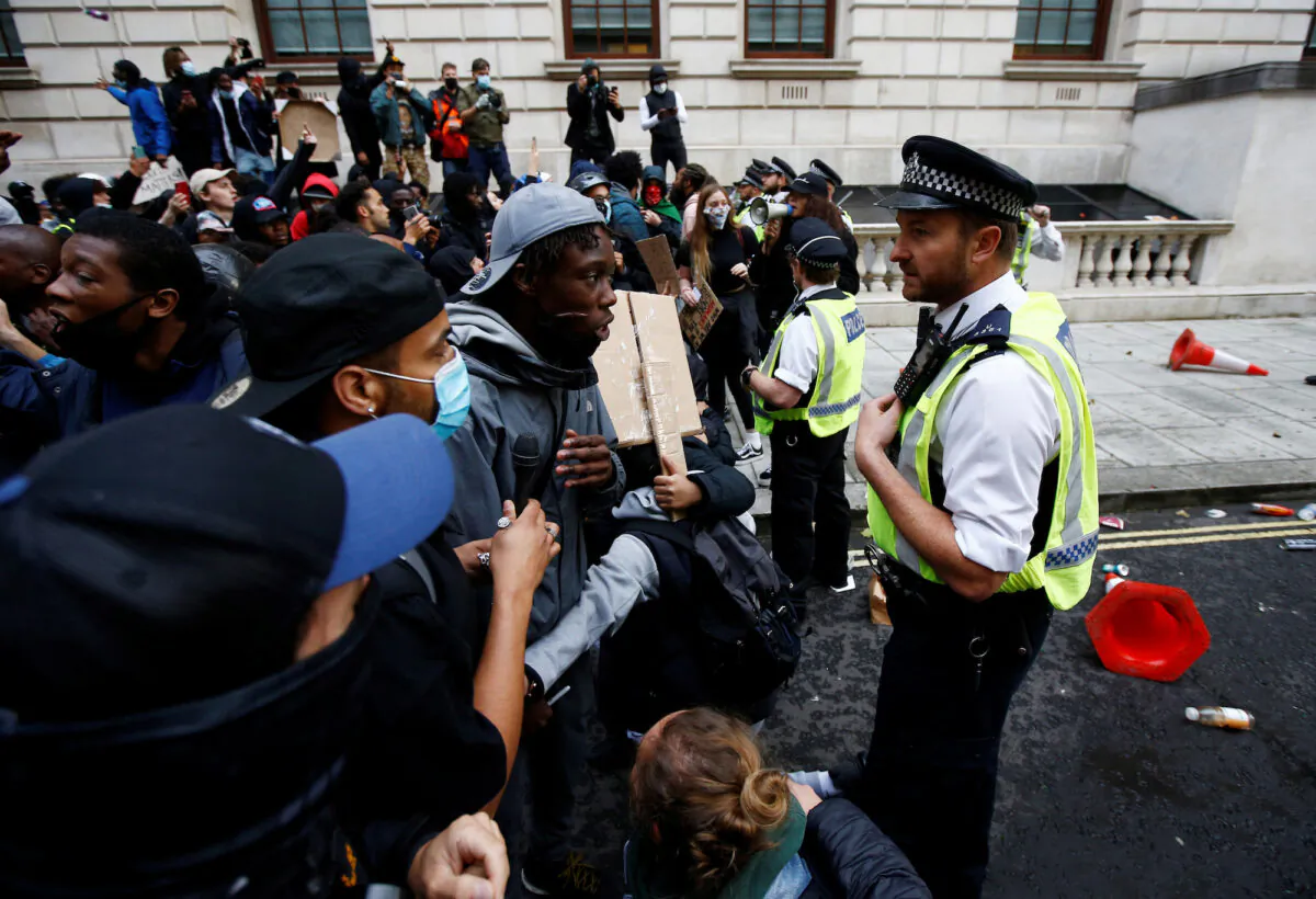 Police clash with demonstrators in London on June 7, 2020. (Peter Nicholls/Reuters)