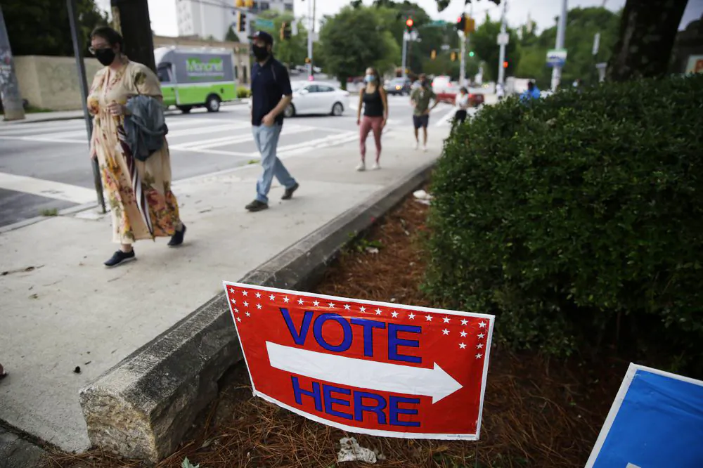 People wait in line to vote in the Georgia's primary election at Park Tavern, in Atlanta, Ga., on June 9, 2020. (Brynn Anderson/ AP Photo)