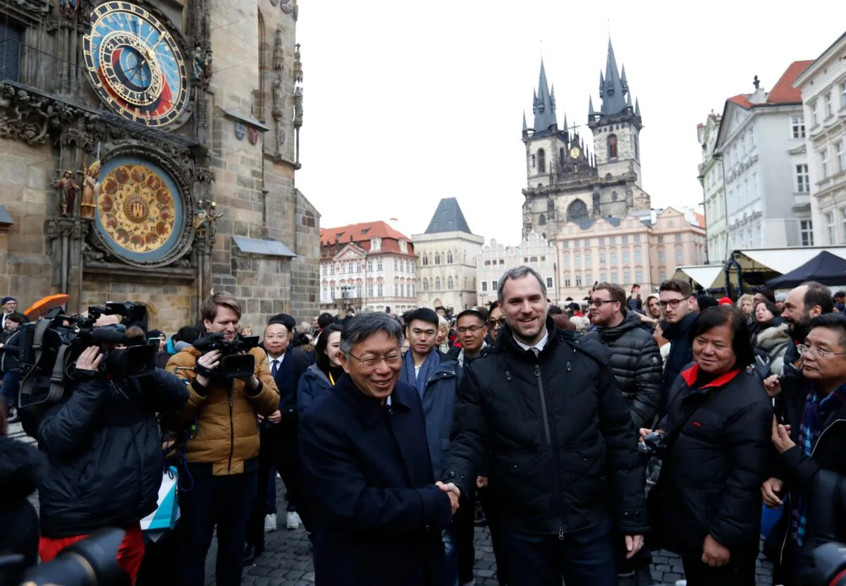 Mayor of Prague Zdenek Hrib (L) and Taipei city mayor Ko Wen-je shake hands before signing a partnership agreement between the two cities at the Old Town Square in Prague, Czech Republic, on Jan. 13, 2020. (Petr David Josek/AP Photo)