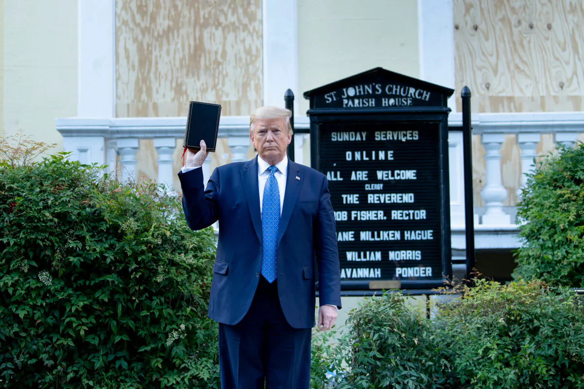 President Donald Trump holds a family Bible while visiting St. John's Church across from the White House in Washington on June 1, 2020. (Brendan Smialowski/AFP via Getty Images)