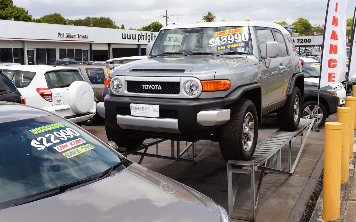 A Toyota vehicle is displayed at a Toyota dealership in Sydney on December 12, 2013, as Australian Prime Minister Tony Abbott sought talks with Toyota to persuade the Japanese giant to keep its plants open and prevent a collapse of Australia's car manufacturing industry.  Abbott acted after US-based General Motors on December 11 announced its Holden offshoot will cease manufacturing in Australia by 2017 after 65 years, prompting Toyota to warn it too was in peril as unions said the car industry was finished.  AFP PHOTO/William WEST        (Photo credit should read WILLIAM WEST/AFP via Getty Images)