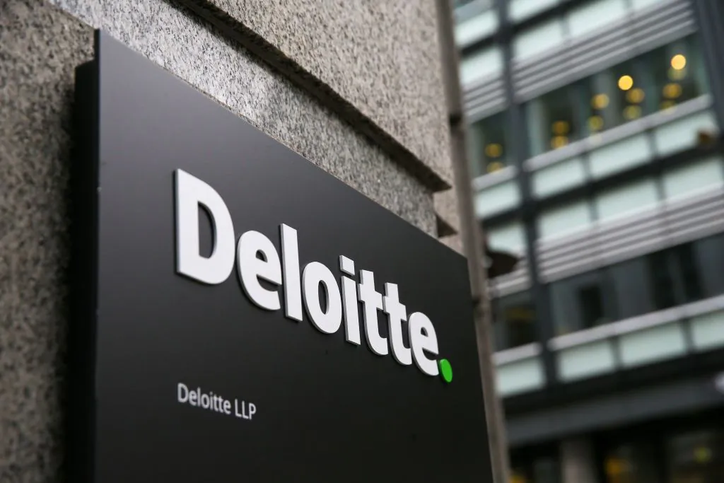 A Deloitte logo is pictured on a sign outside the company's offices in London, England, on Sept. 25, 2017. (Daniel Leal-Olivas/AFP via Getty Images)