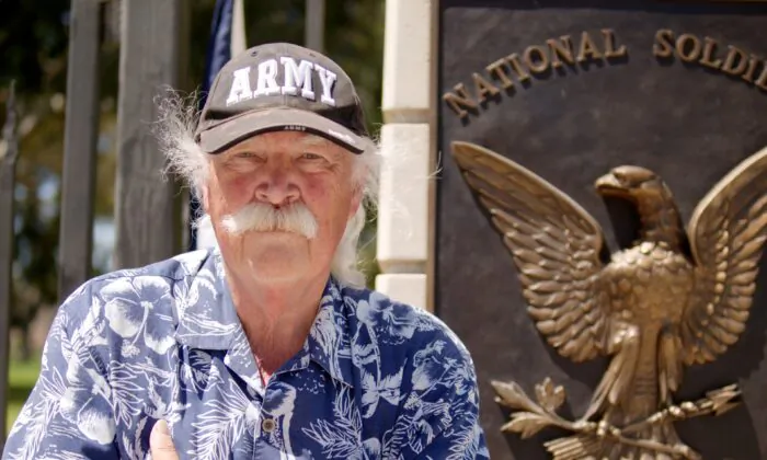 Vietnam War veteran Robert Rosebrock stands in front of the Veteran Affairs (VA) Greater Los Angeles Healthcare System campus to protest uses of the campus he says do not serve veterans, on June 7, 2020. (Hau Nguyen/The Epoch Times)