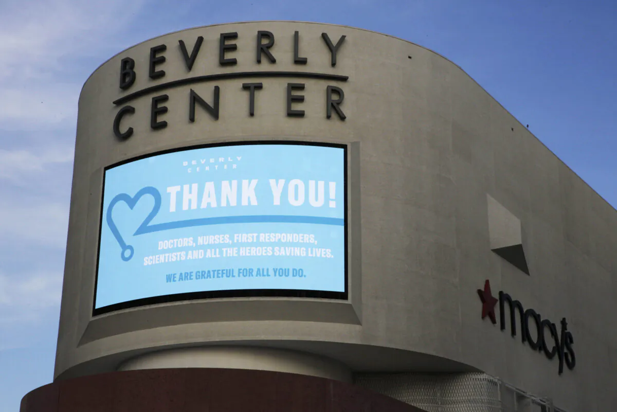 An electronic banner thanks "doctors, nurses, first responders, scientists and all the heroes saving lives" during the CCP virus pandemic, at Beverly Center mall across from Cedars-Sinai Medical Center owned by Simon Properties in West Hollywood, Calif., on May 6, 2020. (Damian Dovarganes/AP Photo)