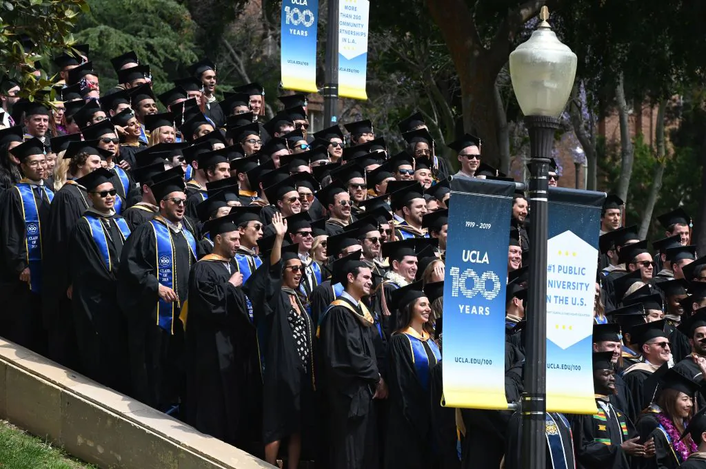 Graduating students pose for a class picture at the University of California Los Angeles (UCLA), in Los Angeles on June 14, 2019. (Robyn Beck/AFP via Getty Images)
