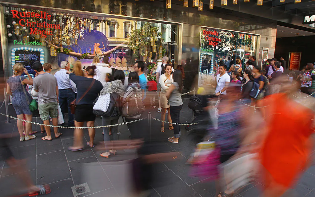 People walk past the Myer Christmas window display as they do their Christmas shopping in Melbourne, Australia, on Dec. 20, 2012. (Scott Barbour/Getty Images)