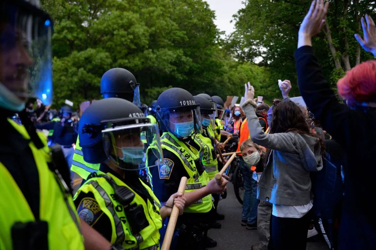 Protesters confront a row of police officers at a demonstration in Franklin Park in Boston, Mass., on June 2, 2020. (Joseph Prezioso/AFP/Getty Images)
