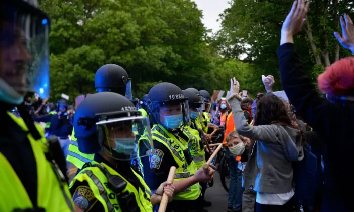 Protesters confront a row of police officers at a demonstration in Franklin Park in Boston, Mass., on June 2, 2020. (Joseph Prezioso/AFP/Getty Images)