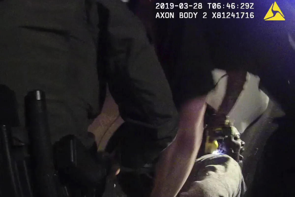 In this image made from a body-worn camera video provided by the Austin Police Department in Texas, Williamson County deputies hold down Javier Ambler as one of them uses a Taser on Ambler’s back during his arrest in Austin, Texas, on March 28, 2019. (Austin Police Department via AP)