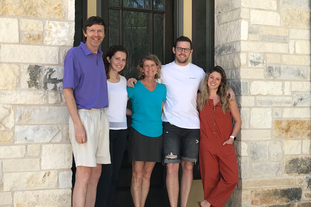 (From left) Ken Frankenfeld stands with his daughter, Caroline Frankenfeld, his wife, Sarah Frankenfeld, his son, Kevin Frankenfeld, and Kevin’s girlfriend, Maddie Haller, outside the Frankenfelds’ home in Austin, Texas, on May 3, 2020. Kevin and Maddie live in New York City but left to quarantine at the Frankenfelds’ townhome after the COVID-19 pandemic worsened in New York. (Sharon Jayson for KHN)