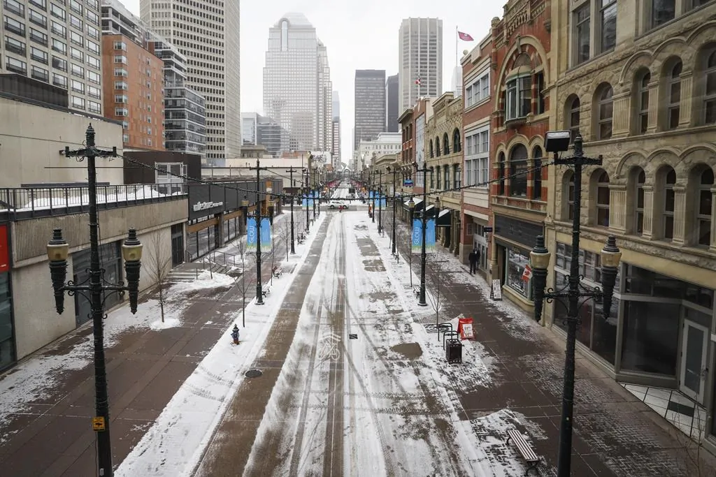 Empty downtown streets in Calgary, Alta. on March 18, 2020, amid a worldwide COVID-19 pandemic. (Jeff McIntosh/The Canadian Press)