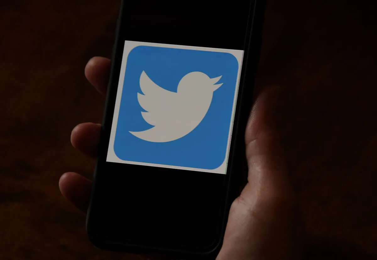 A Twitter logo is displayed on a mobile phone in Arlington, Va. on May 27, 2020. (Olivier Douliery/AFP via Getty Images)