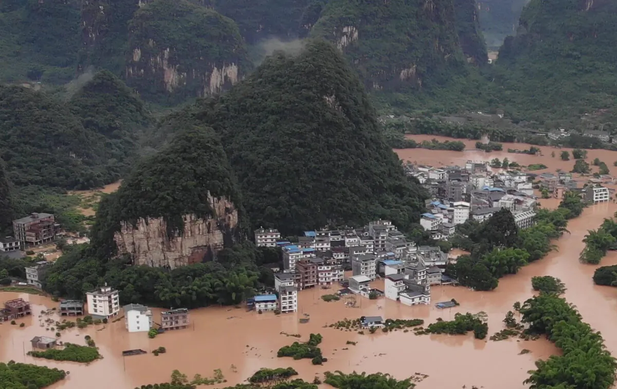 Streets and buildings are submerged under flood water in Yangshuo, in China's southern Guangxi region on June 7, 2020. (STR/AFP via Getty Images)