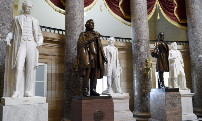 A statue of Jefferson Davis, second from left, president of the Confederate States from 1861 to 1865, is on display in Statuary Hall on Capitol Hill in Washington in a June 24, 2015, file photograph. (Susan Walsh/AP Photo)