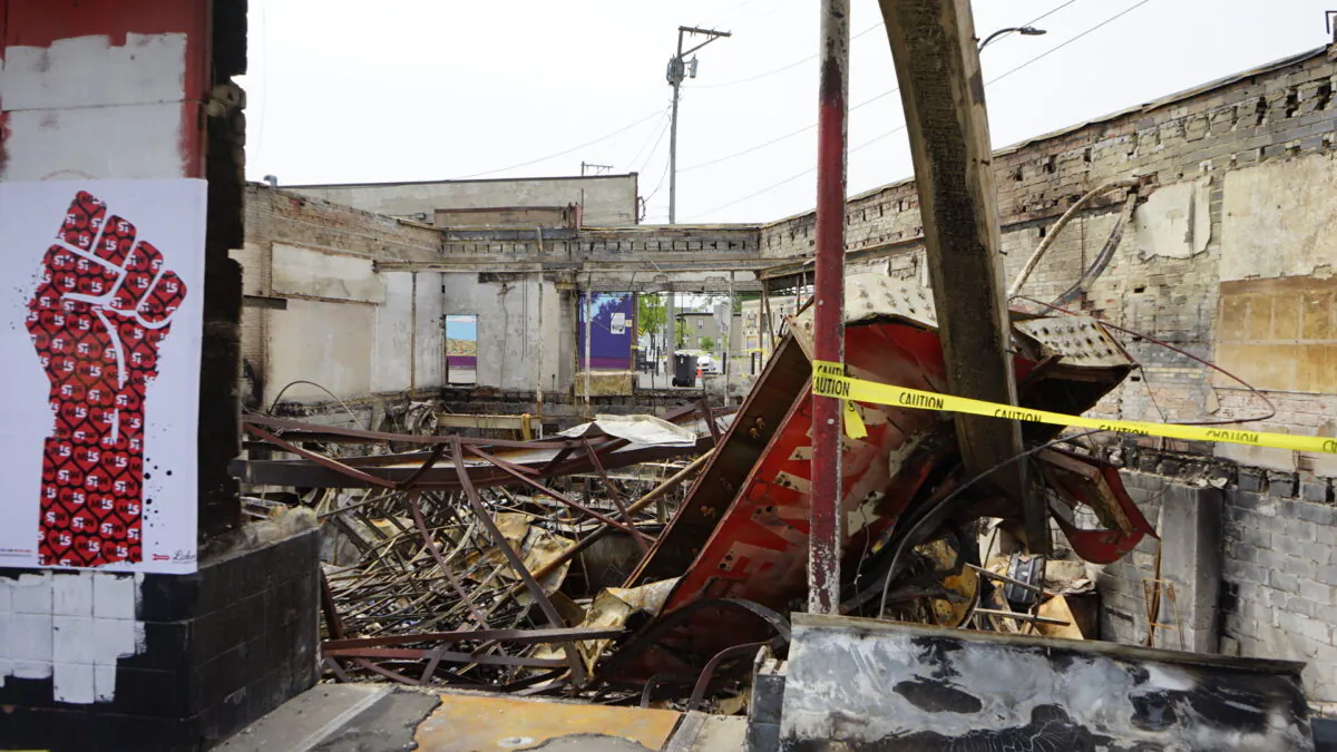 The debris left over after the Minnehaha Lake Wine & Spirit shop was burned down by rioters followed by the death of George Floyd in Minneapolis, Minn., on June 9, 2020. (Meiling Lee/The Epoch Times)