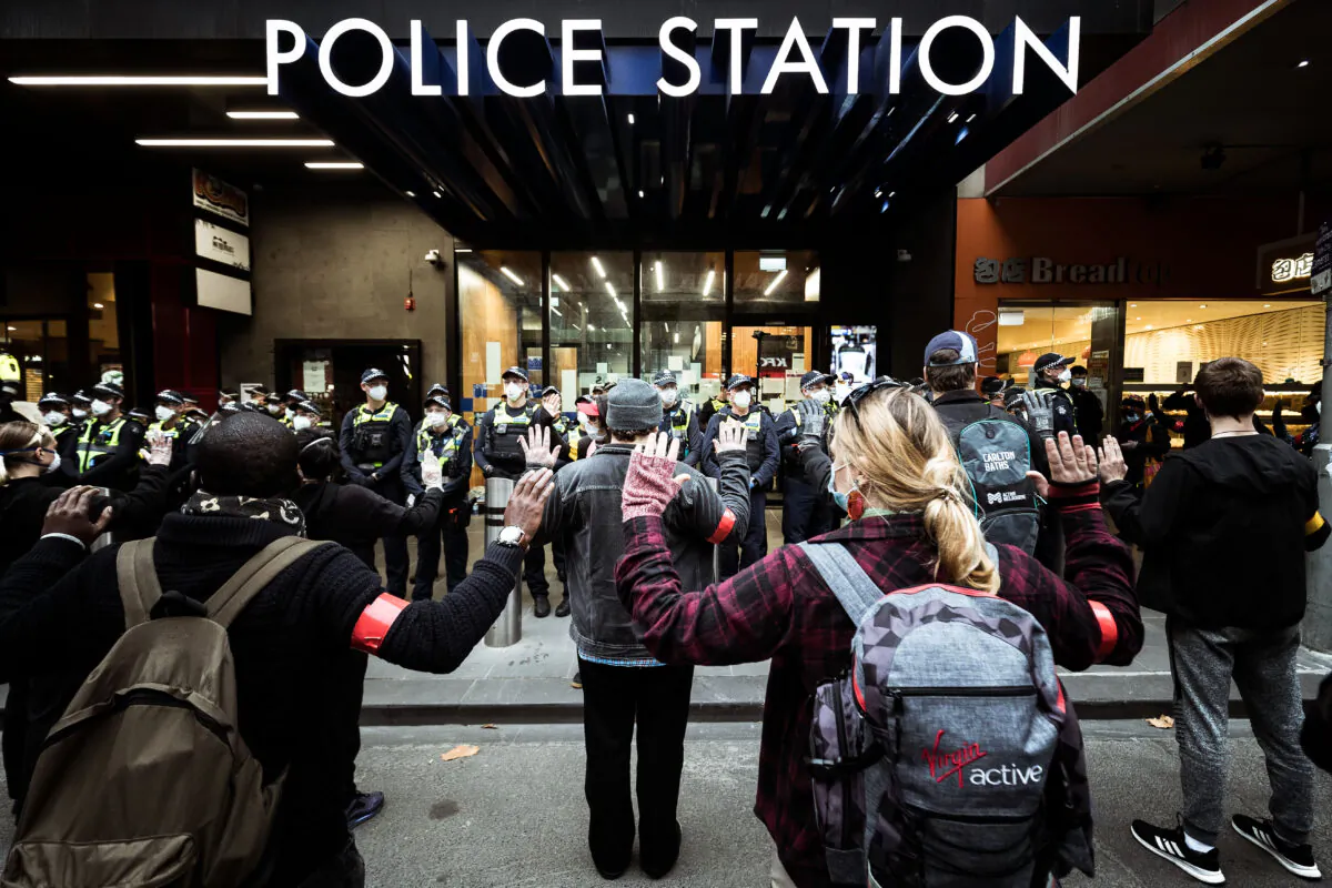 Protestors stand in front of Police to prevent conflict in Melbourne, Australia on June 6, 2020. (Darrian Traynor/Getty Images)