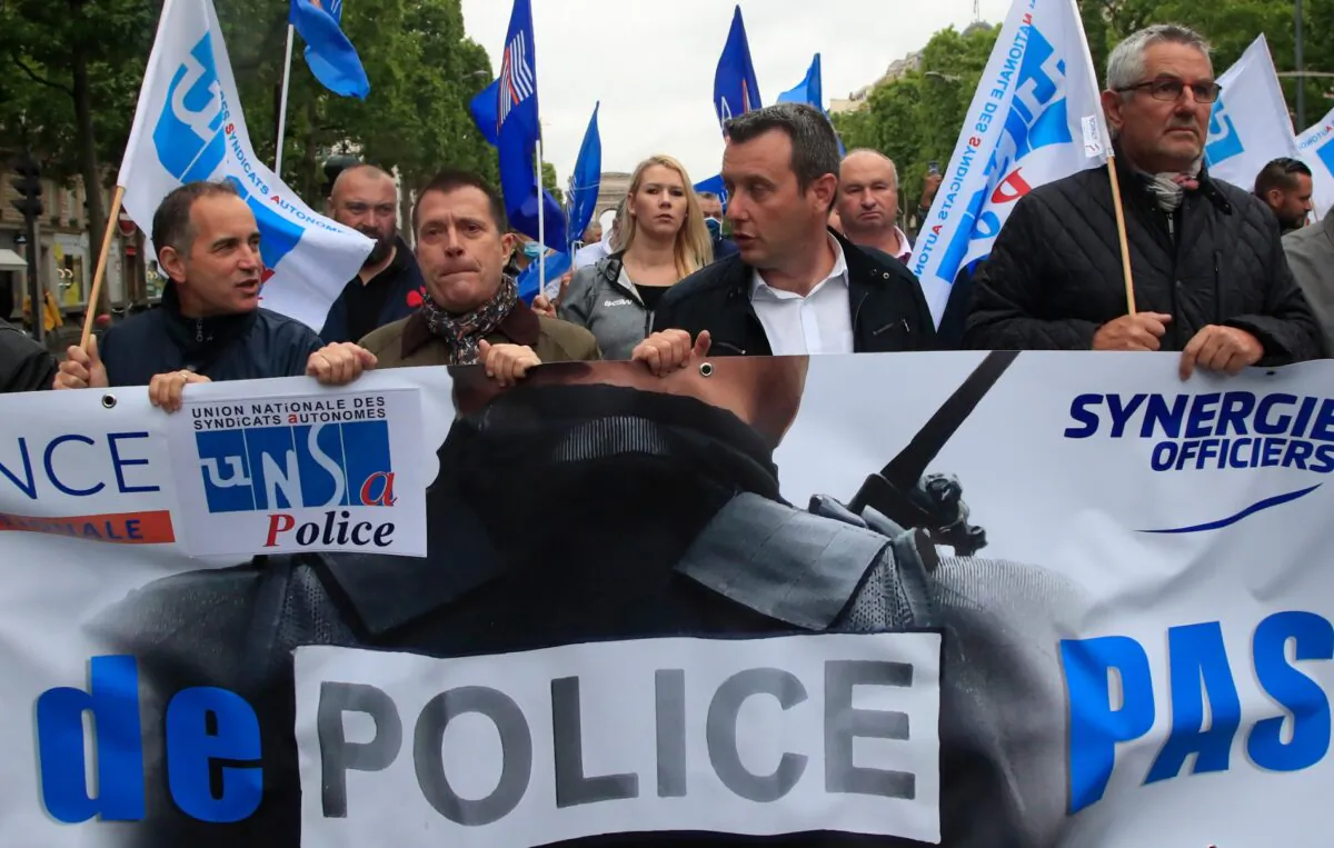 French police unionists demonstrate with a banner reading "No police, no peace" down the Champs-Elysee avenue, in Paris, France, on June 12, 2020. (Michel Euler/AP Photo)