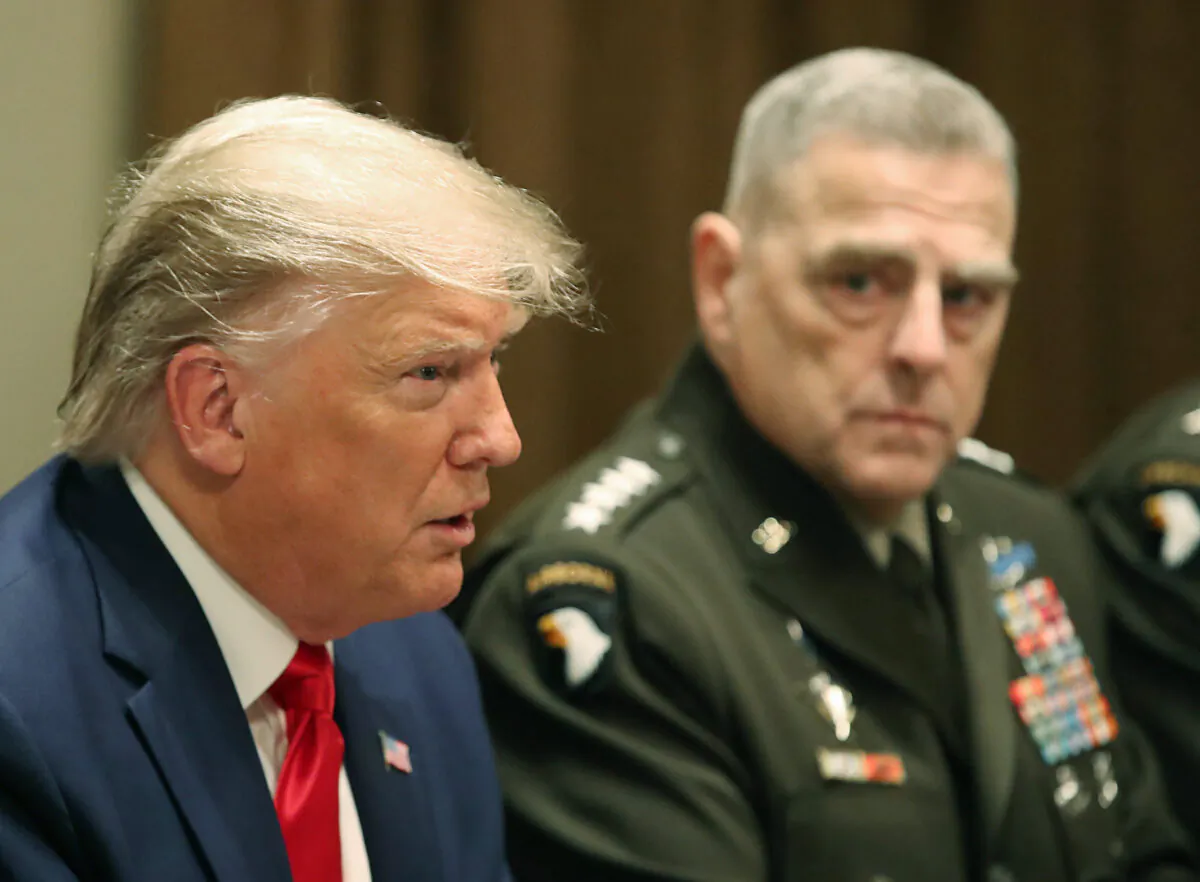 Then-President Donald Trump speaks as Joint Chiefs of Staff Chairman Army Gen. Mark Milley looks on, in Washington on Oct. 7, 2019. (Mark WIlson/Getty Images)