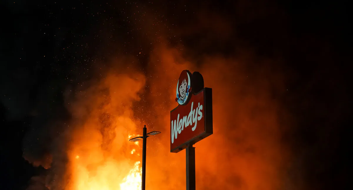 Wendy’s burns following a rally against racial inequality and the police shooting death of Rayshard Brooks in Atlanta, Ga., on June 13, 2020. (Elijah Nouvelage/Reuters)