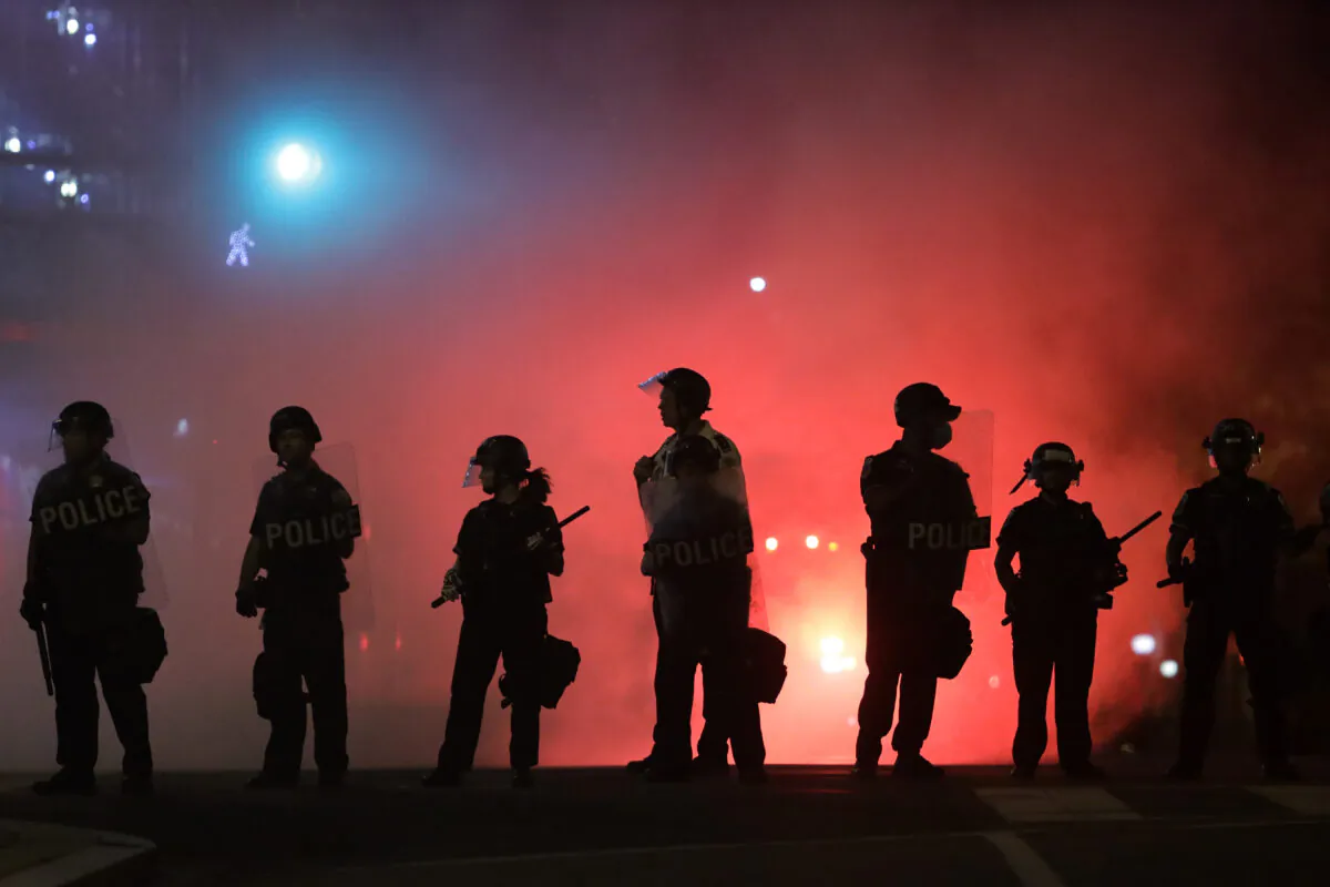 Police hold a perimeter near during George Floyd protests in Washington DC.  (Photo by Alex Wong/Getty Images)