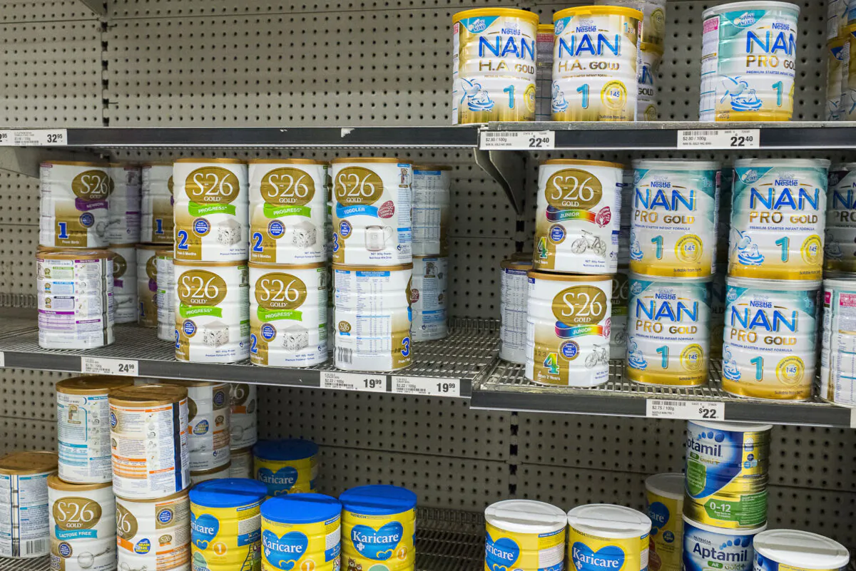 Shelves of baby formula with signs warning customers that they are limited to 8 cans per customers at a large Sydney supermarket on November 12, 2015 in Sydney, Australia. (Christopher Pearce/Getty Images)