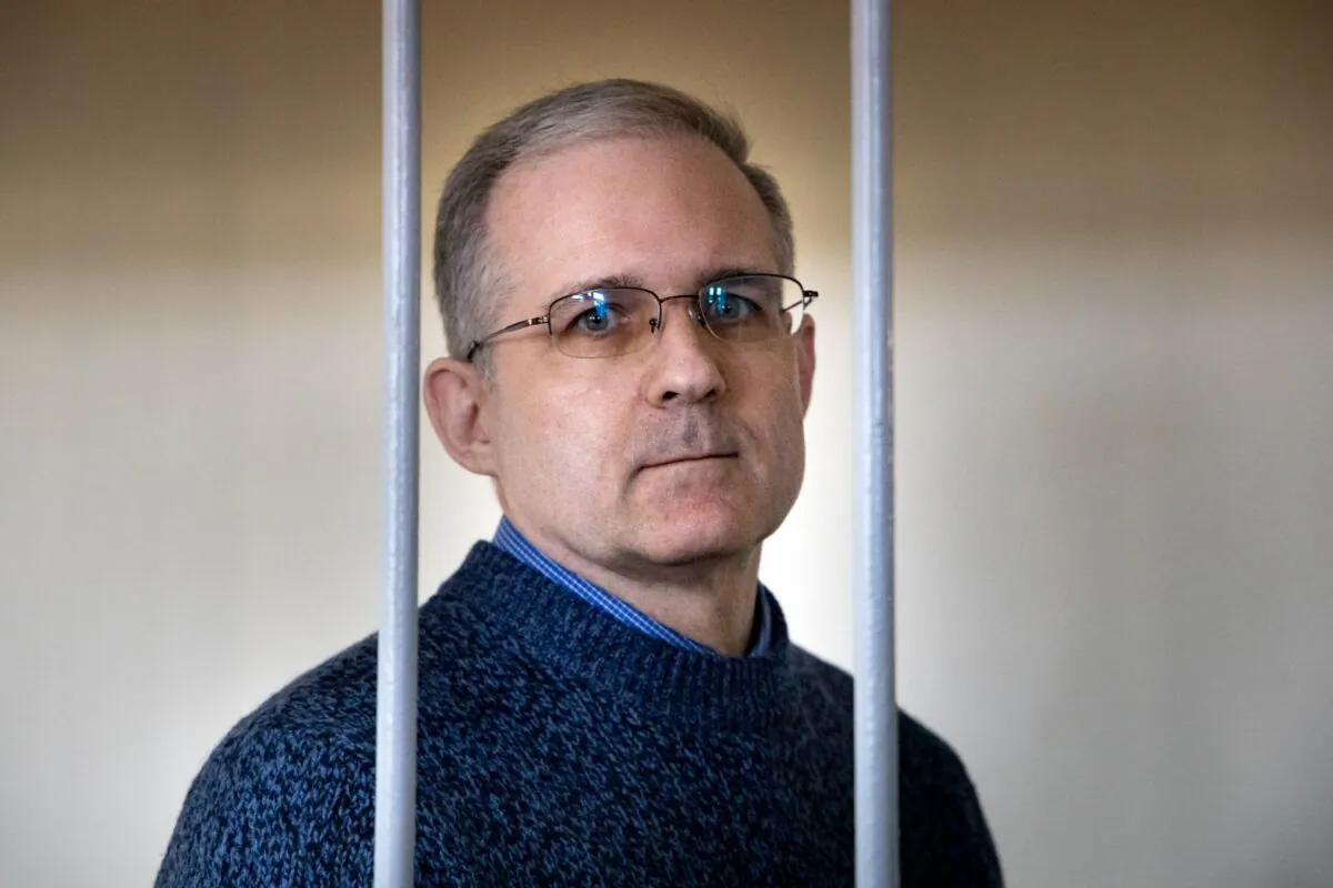 Paul Whelan, a U.S. Marine veteran who was arrested for alleged spying in Moscow on Dec. 28, 2018, stands in a cage as he waits for a hearing in a courtroom in Moscow, Russia, on Aug. 23, 2019. (Alexander Zemlianichenko/File/AP Photo)