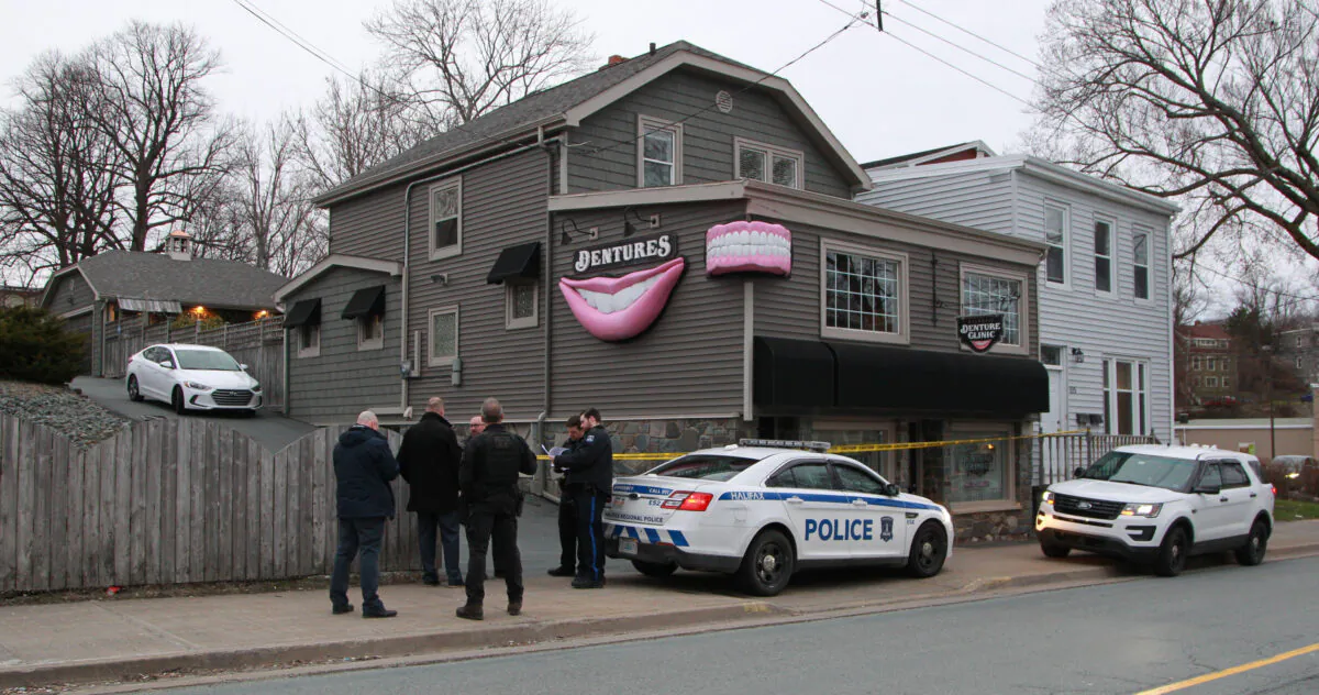Regional police investigators confer outside the Atlantic Denture Clinic in Dartmouth, Nova Scotia, Canada, on April 20, 2020. (Tim Krochak/Getty Images)