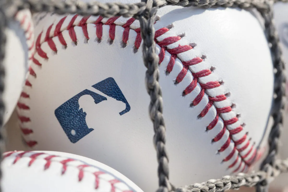 A baseball with MLB logo is seen at a game, in a file photo. (Mitchell Leff/Getty Images)