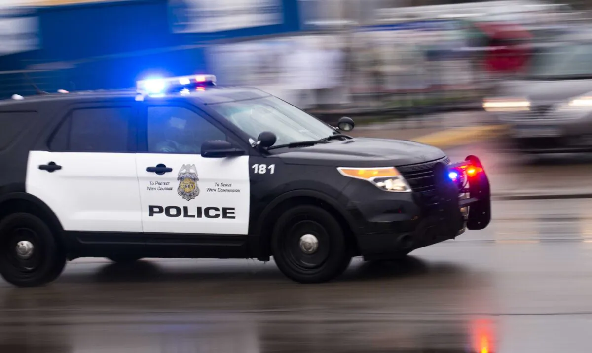 A police car drives by in Minneapolis, Minn., on May 26, 2020. (Stephen Maturen/Getty Images)