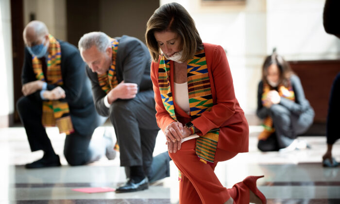 Speaker of the House Nancy Pelosi (D-Calif.) and other Democratic lawmakers take a knee to observe a moment of silence on Capitol Hill for George Floyd and other victims of police brutality in Washington on June 8, 2020. (Brendan Smialowski/AFP via Getty Images)