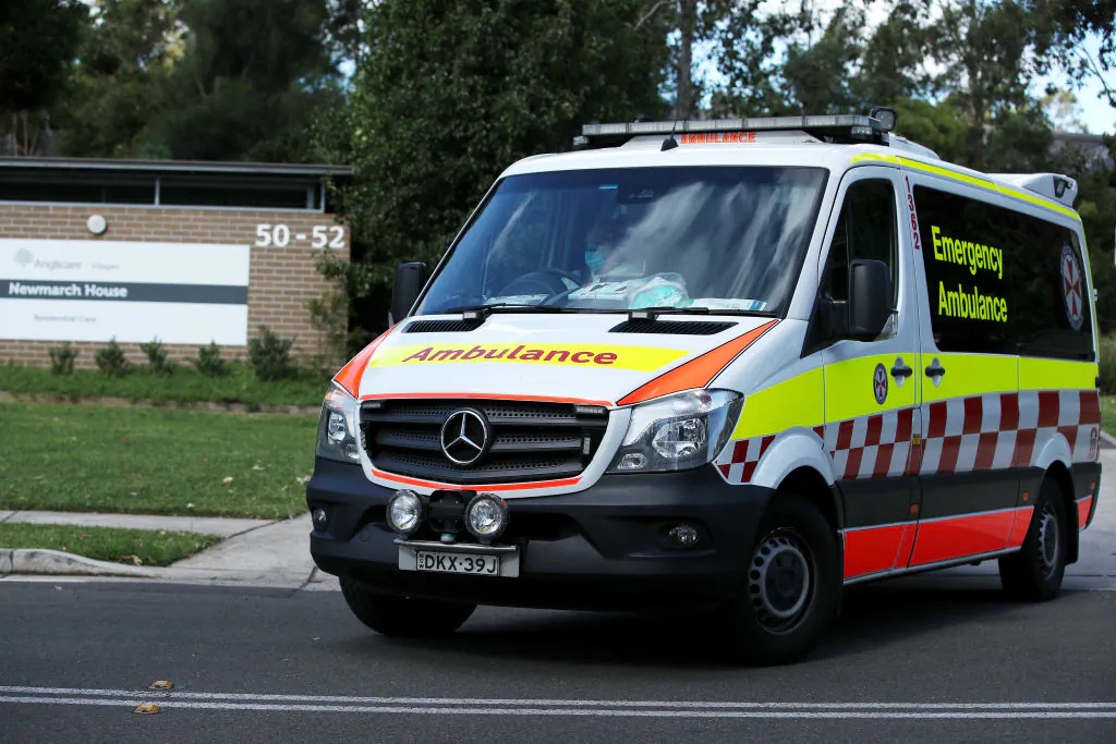 An New South Wales ambulance leaves Newmarch House with a patient on May 01, 2020 in Sydney, Australia.(Cameron Spencer/Getty Images)