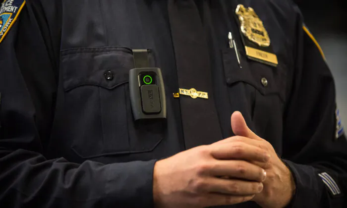 A New York City police officer wears a body camera during a press conference in New York in 2014. (Andrew Burton/Getty Images)