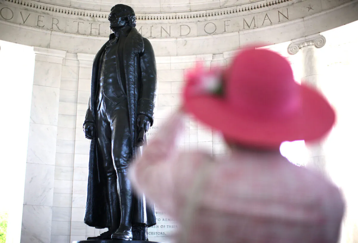 Bertrand L. Taylor III, a member of the Monticello Cabinet of The Thomas Jefferson Foundation, takes photographs of the statue of Thomas Jefferson after the 69th annual Jefferson Memorial Ceremony April 13, 2012 at Thomas Jefferson Memorial in Washington. (Alex Wong/Getty Images)