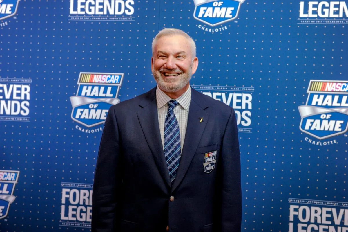 Former driver and television commentator Dale Jarrett poses for photographers on the red carpet before the start of the NASCAR Hall of Fame Induction ceremony in Charlotte, N.C., on Jan. 20. 2017. (Mike McCarn/File/AP Photo)