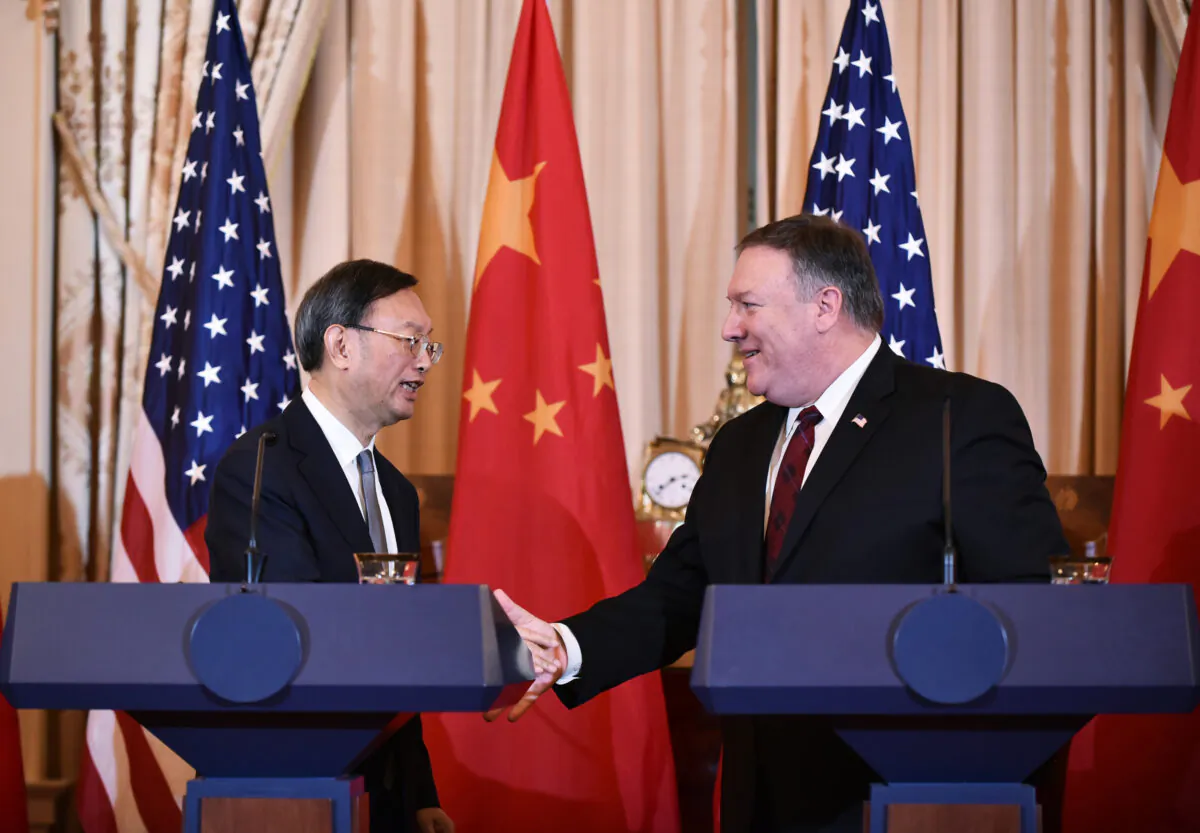 Secretary of State Mike Pompeo and Chinese politburo member Yang Jiechi shake hands following a press conference during the U.S.-China Diplomatic and Security Dialogue in the Benjamin Franklin Room of the State Department in Washington, on Nov. 9, 2018. (Mandel Ngan/ AFP/Getty Images)