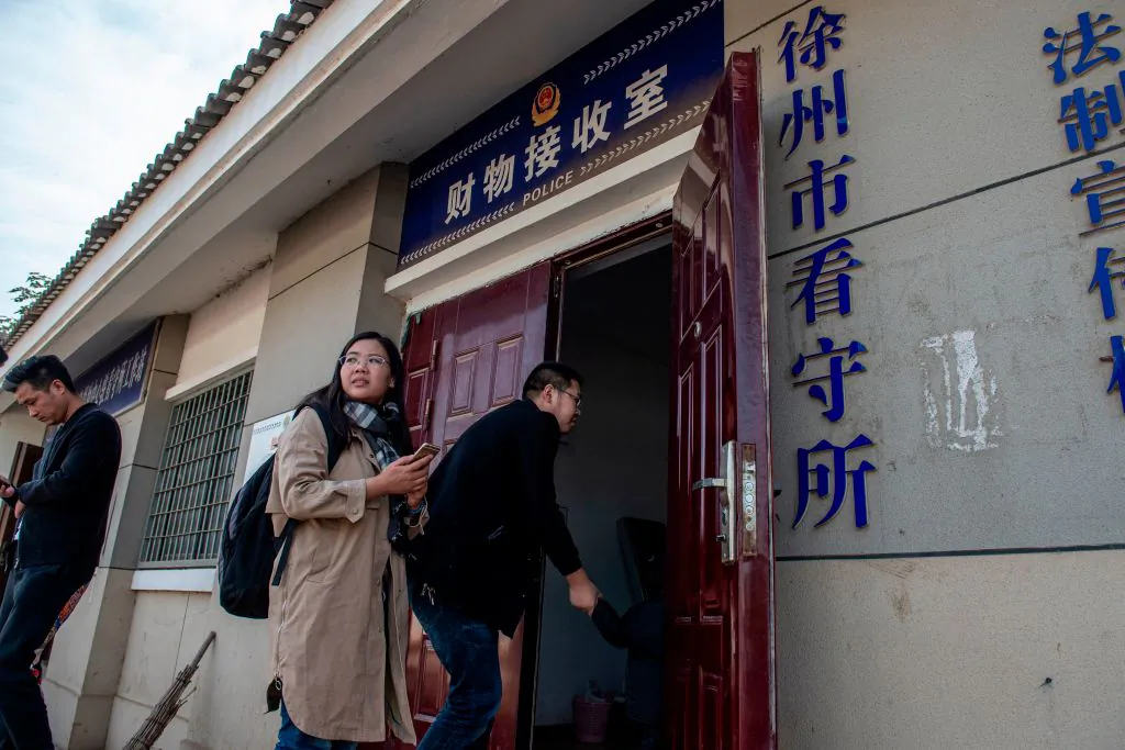 Xu Yan, wife of human rights lawyer Yu Wensheng, enters an office at the Xuzhou City Detention Center in Xuzhou, Jiangsu Province, China, on Oct. 30, 2019. (Nicolas Asfouri/AFP via Getty Images)