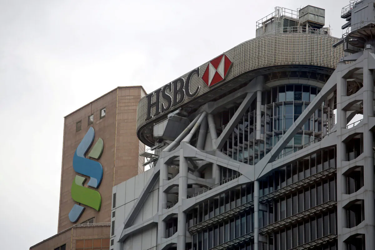 Logos of HSBC and Standard Chartered banks are seen at their headquarters in Hong Kong, China, on Sept. 5, 2017. (Bobby Yip/Reuters)