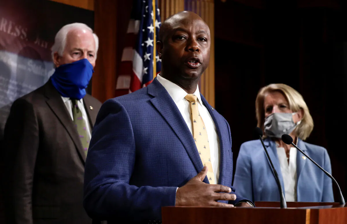 Sen. Tim Scott (R-S.C.) is flanked by Sens. Shelley Moore Capito (R-W.Va.) and John Cornyn (R-Texas) as he speaks about his new police reform bill unveiled by Senate Republicans during a news conference on Capitol Hill in Washington on June 17, 2020. (Yuri Gripas/Reuters)