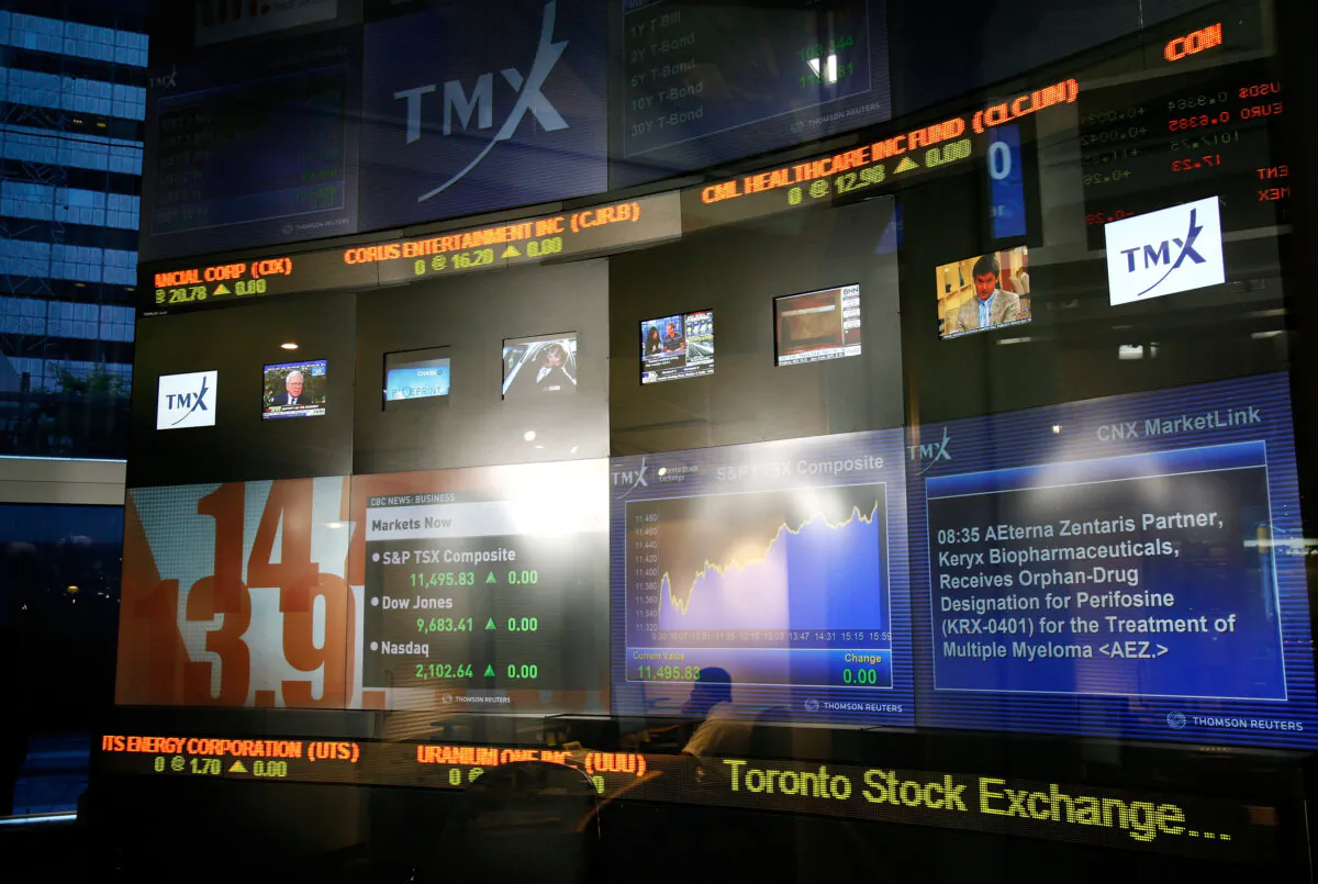 A multimedia information screen for the Toronto Stock Exchange in Toronto in a file photo. Provincial securities regulators are working on rules to ensure investors have reliable financial information on Canadian companies with overseas operations and foreign companies that trade on Canada’s stock exchanges. (Malcolm Taylor/Getty Images)