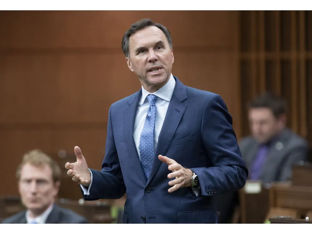 Then-finance minister Bill Morneau rises during question period in the House of Commons in Ottawa on May 26, 2020. (The Canadian Press/Adrian Wyld)