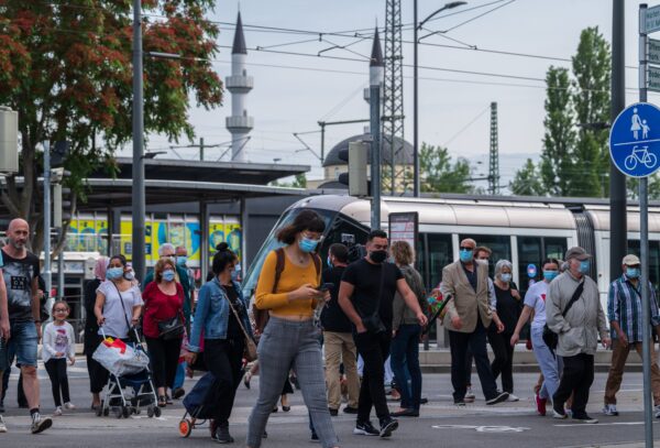 French passengers step out of the tram
