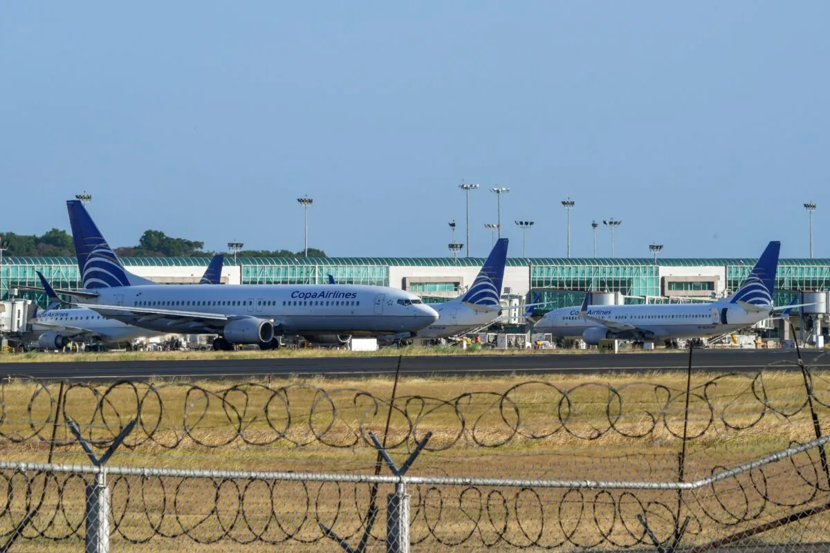 During the global pandemic of the CCP virus, a Copa airlines plane taxis on a runway as others sit on the tarmac at Tocumen International Airport, on March 22, 2020. (Luis Acosta/AFP/Getty Images)