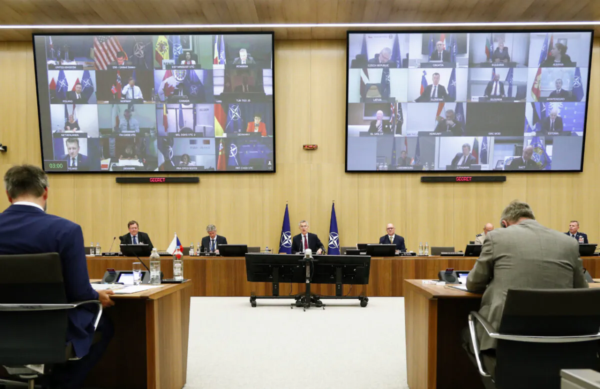 NATO Secretary General Jens Stoltenberg, center, speaks during a video conference of NATO Defense Minister at the NATO headquarters in Brussels, Wed., June 17, 2020. (Francois Lenoir/AP)