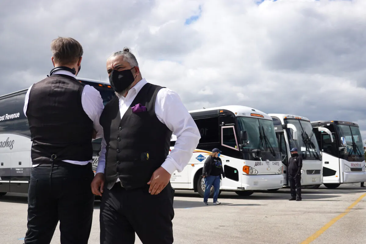 Motorcoach owners and drivers stand near O'Hare Airport in Rosemont, Ill., on May 11, 2020. (Scott Olson/Getty Images)