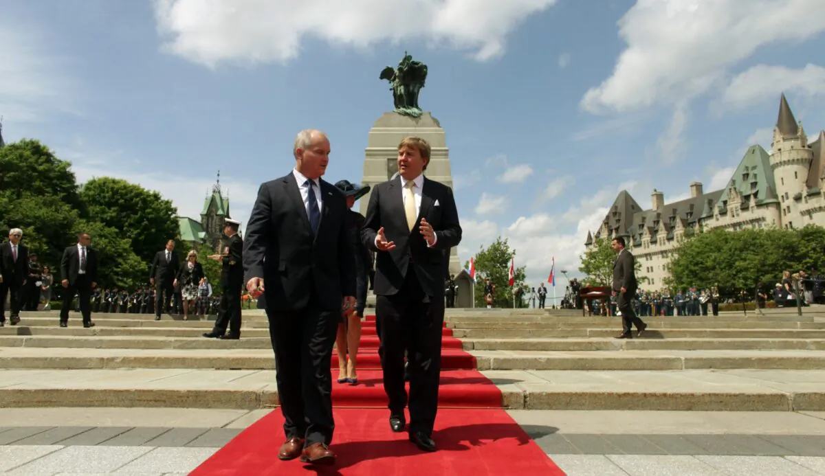 Canada's Minister of Veterans Affairs Erin O'Toole (L) walks with King Willem-Alexander of the Netherlands during a wreath laying ceremony at The Tomb of the Unknown Soldieron May 27, 2015 in Ottawa, Canada. The King and Queen is on a three-day visit to Canada. (Photo by Dave Chan/AFP via Getty Images)