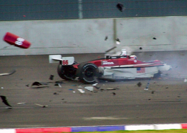 Italian driver Alex Zanardi sitting in his car