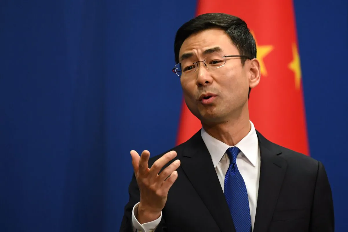 Chinese Foreign Ministry spokesman Geng Shuang speaks during the daily press briefing in Beijing on March 18, 2020. (Greg Baker/AFP via Getty Images)