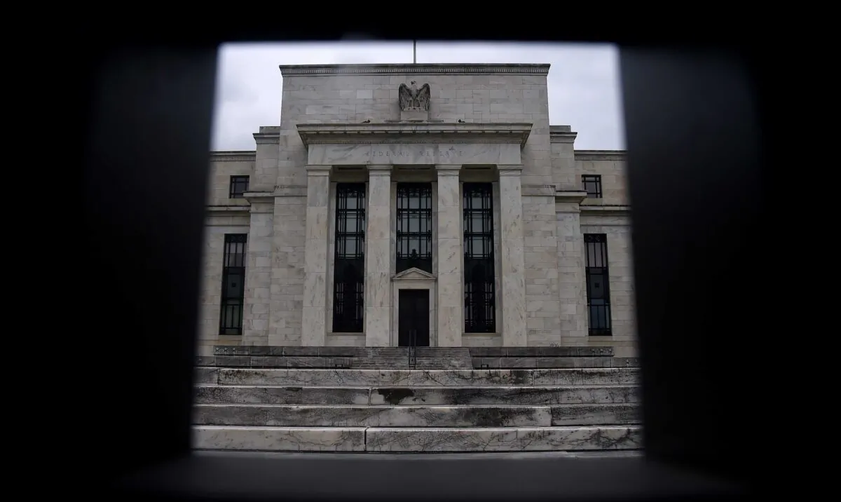 The Federal Reserve Building seen through a fence in Washington on June 17, 2020. (Olivier Douliery/AFP via Getty Images)