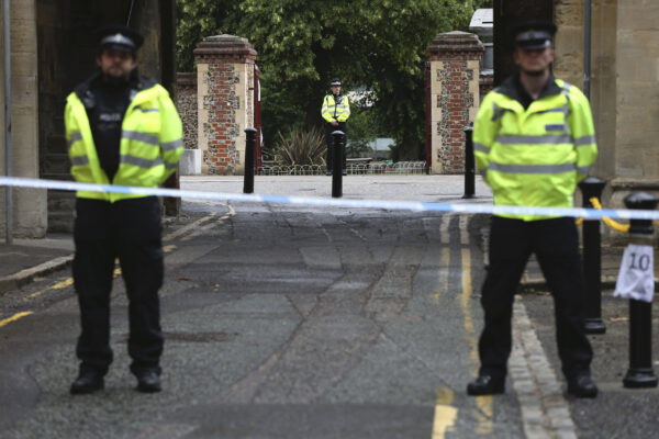 Police stand guard at the Abbey gateway