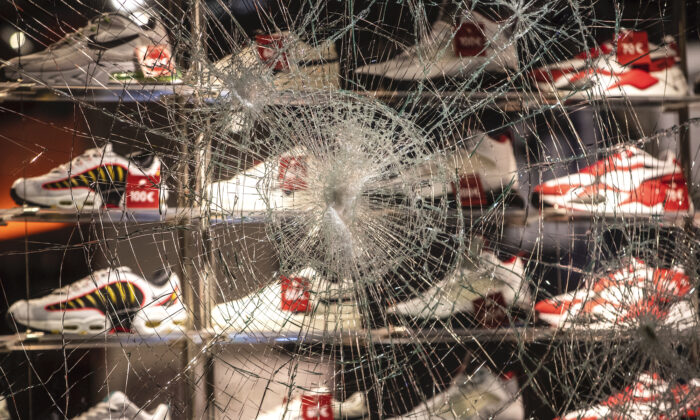A window of a shop for shoes is destroyed at the Koenigstrasse in Stuttgart, Germany, on June 21, 2020.  (Christoph Schmidt/dpa via AP)